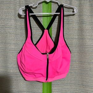 Victoria’s Secret hot pink sports bra with front zip.